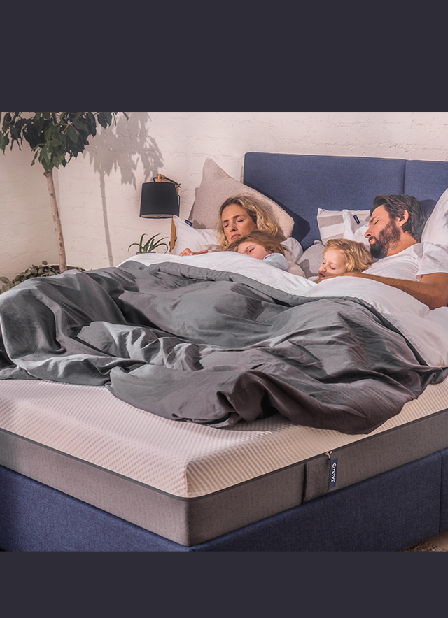 Family sleeping on Emma Mattress Family sleeping on Emma Mattress